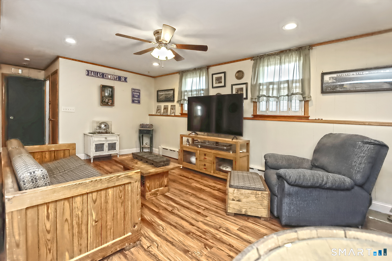 6 Mt Pleasant Road West Haven, CT 06516 - Photo 25 of 40 a living room with furniture and a flat screen tv