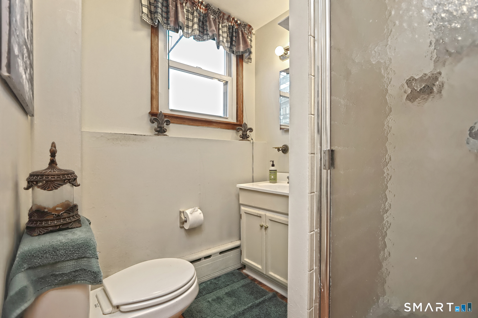6 Mt Pleasant Road West Haven, CT 06516 - Photo 28 of 40 a bathroom with a toilet a sink and mirror