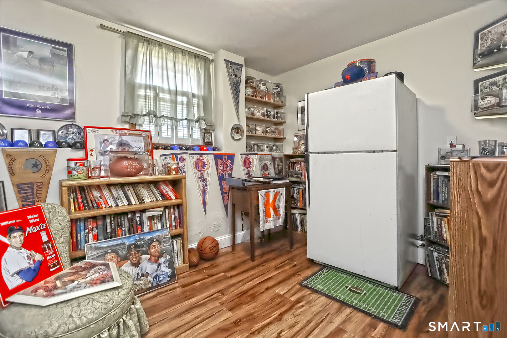 6 Mt Pleasant Road West Haven, CT 06516 - Photo 30 of 40 a room with furniture a refrigerator and a bookshelf