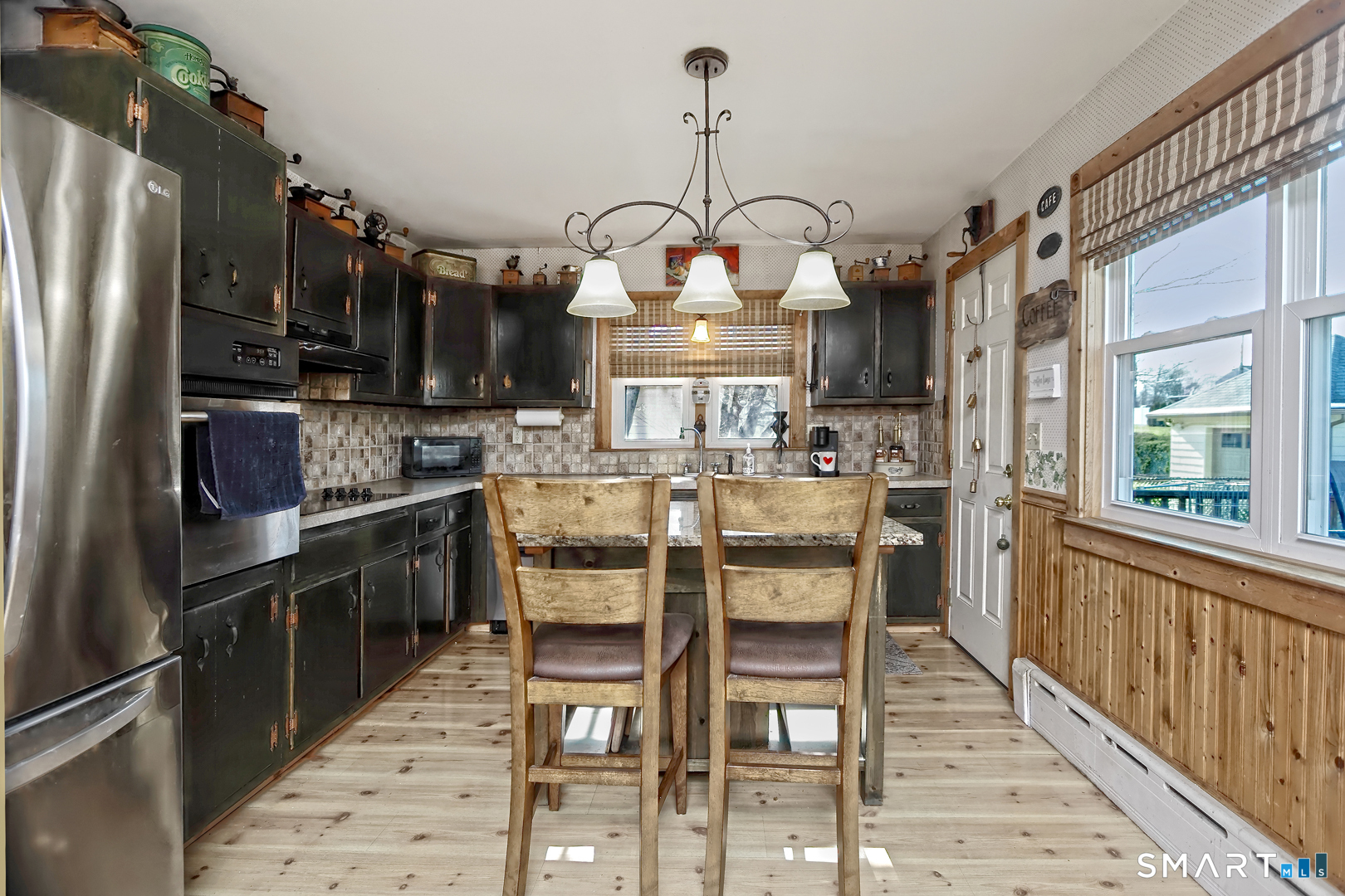 6 Mt Pleasant Road West Haven, CT 06516 - Photo 10 of 40 a kitchen with stainless steel appliances granite countertop a sink refrigerator and cabinets