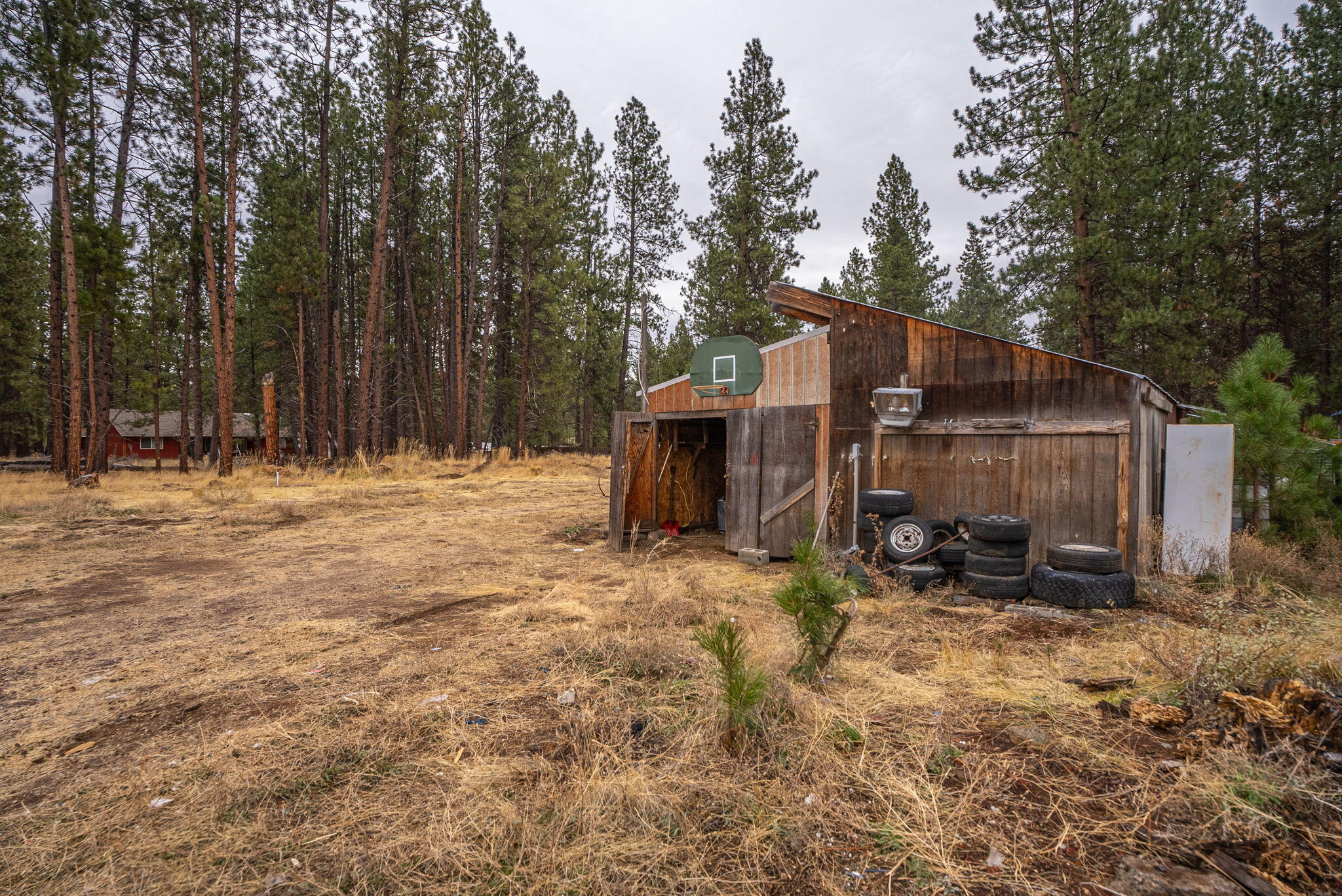 59674 Navajo Road Bend, OR 97702 - Photo 37 of 47 Backyard workshop in need of significant repairs or teardown.