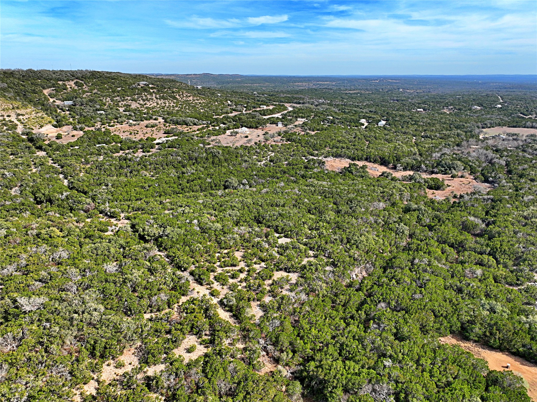 2102 Montell Road Wimberley, TX 78676 - Photo 15 of 18 an aerial view of residential houses with outdoor space and trees
