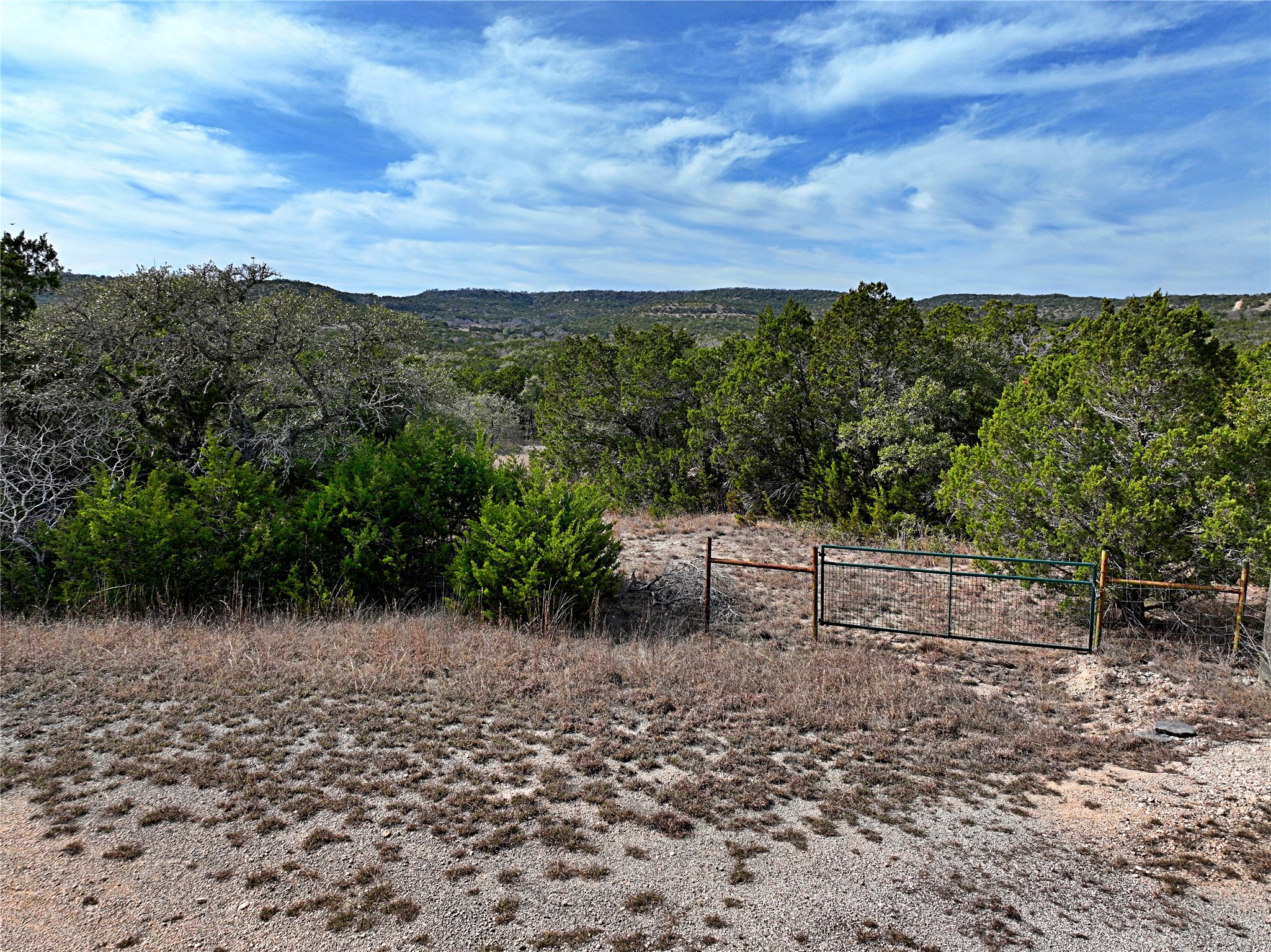 2102 Montell Road Wimberley, TX 78676 - Photo 17 of 18 a view of a bench in a backyard