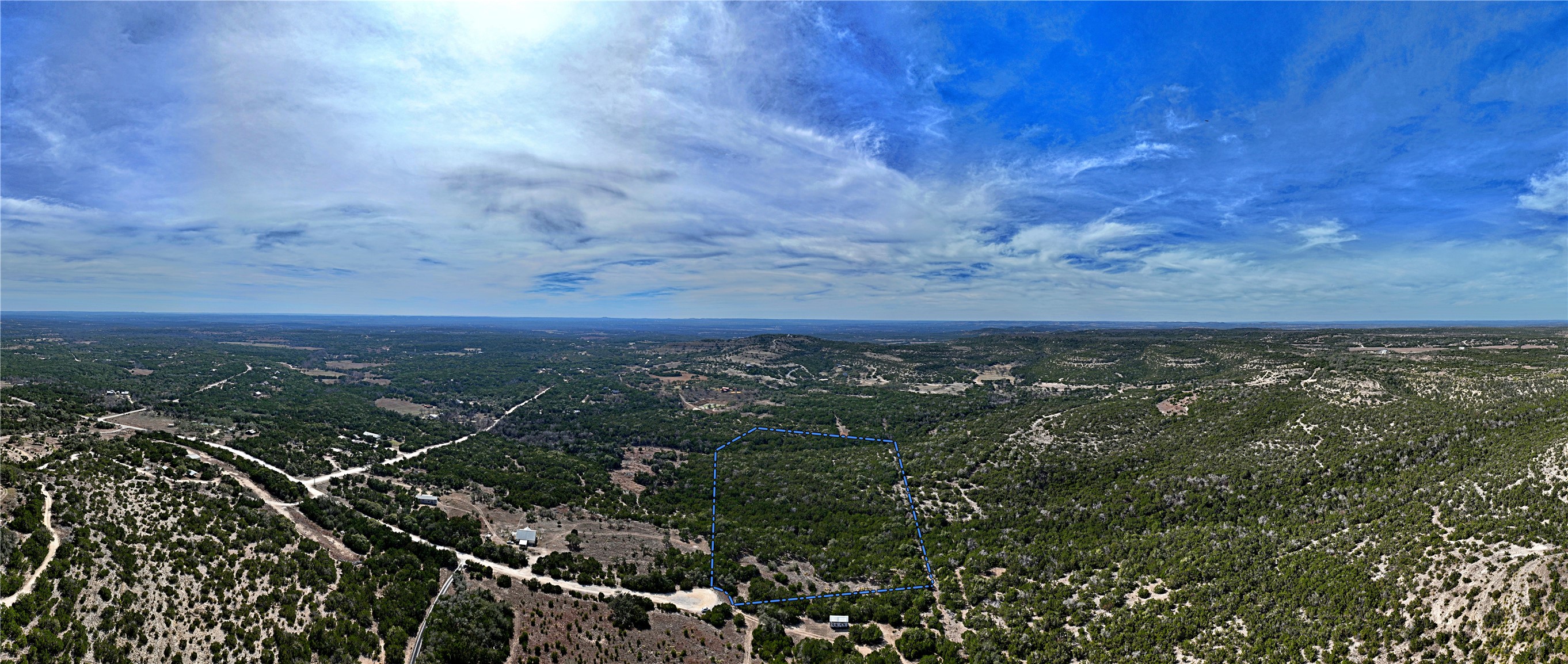 2102 Montell Road Wimberley, TX 78676 - Photo 2 of 18 a view of a city with lush green forest