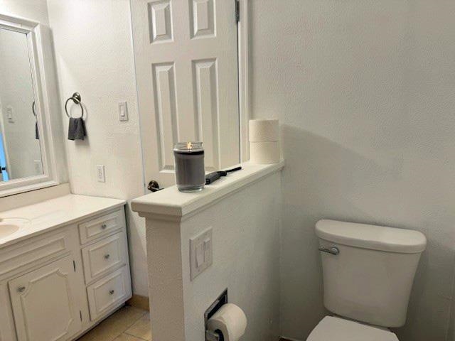 557-28 28 3/4 Road Grand Junction, CO 81501 - Photo 14 of 19 a bathroom with a toilet sink and mirror