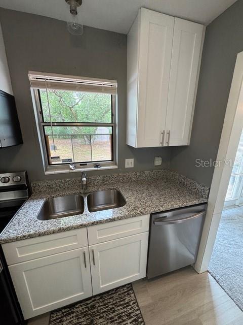 2501 Sheridan Road Mount Dora, FL 32757 - Photo 11 of 21 a kitchen with granite countertop a sink and a stove top oven
