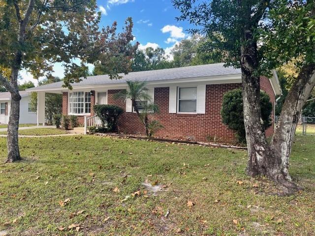 2501 Sheridan Road Mount Dora, FL 32757 - Photo 2 of 21 a view of a house with a yard