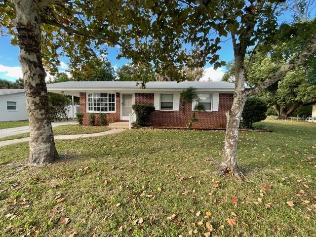 2501 Sheridan Road Mount Dora, FL 32757 - Photo 5 of 21 front view of a house with a yard