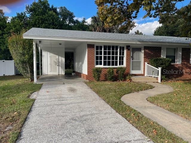 2501 Sheridan Road Mount Dora, FL 32757 - Photo 6 of 21 front view of a house with a yard