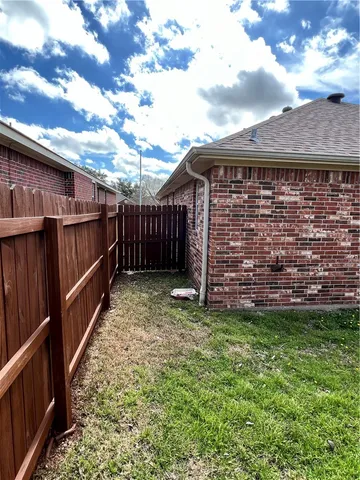 a view of a house with a garden