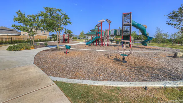 a view of a park with swings