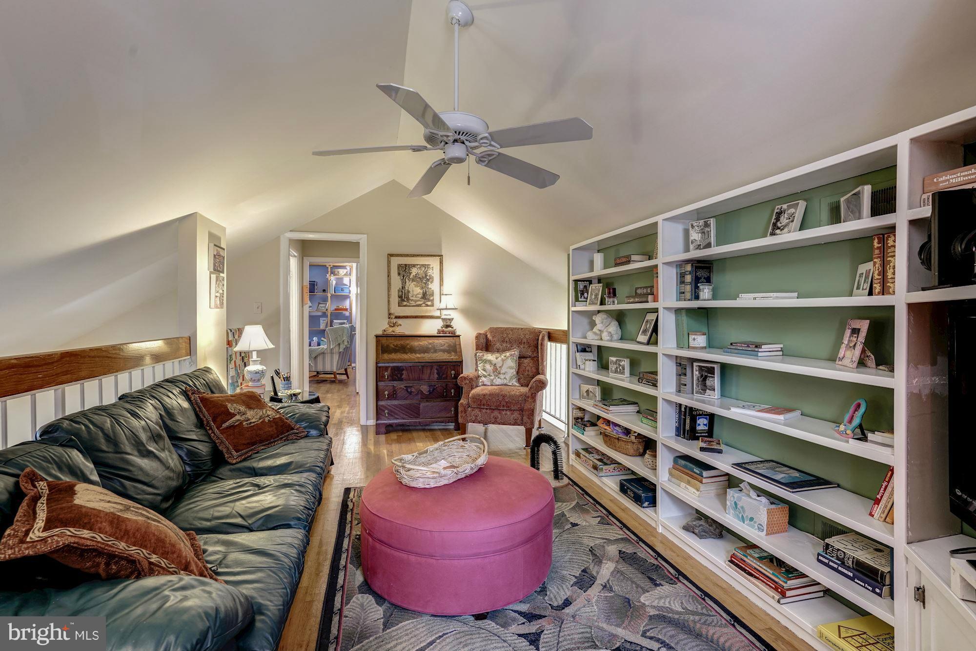 1416 Green Run Lane Reston, VA 20190 - Photo 17 of 29 a living room with furniture and a book shelf