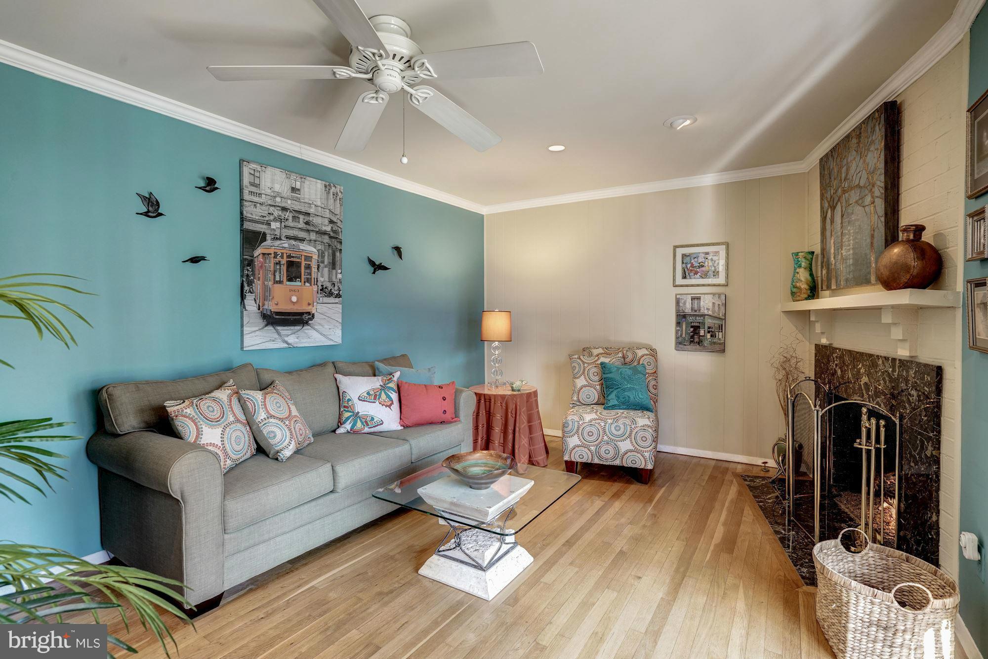 1416 Green Run Lane Reston, VA 20190 - Photo 3 of 29 a living room with furniture and a fireplace