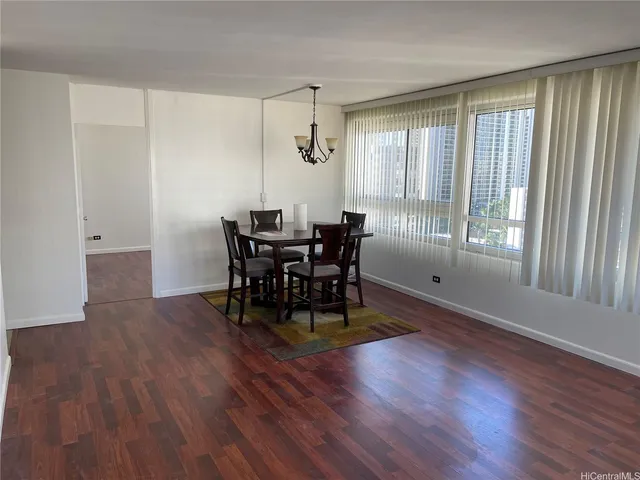 a view of a dining room with furniture and window