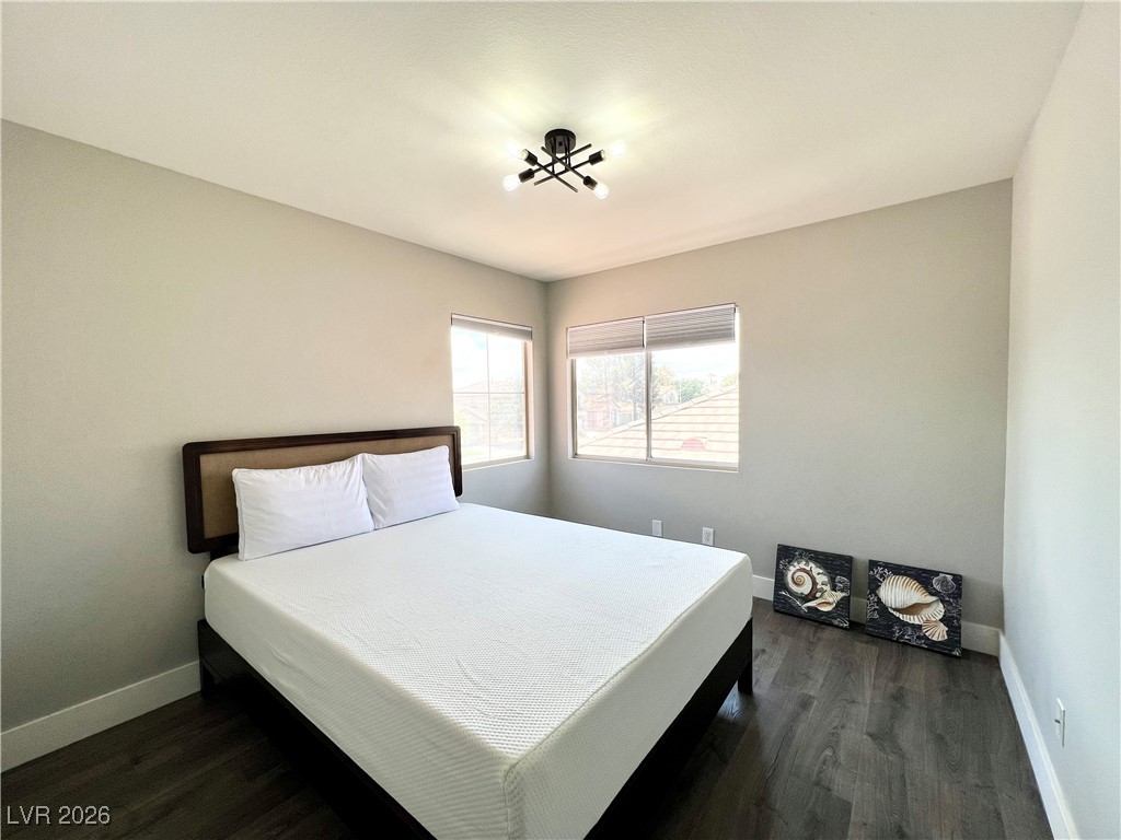 2218 Armacost Drive Henderson, NV 89074 - Photo 11 of 31 Bedroom with baseboards and dark wood-style floors