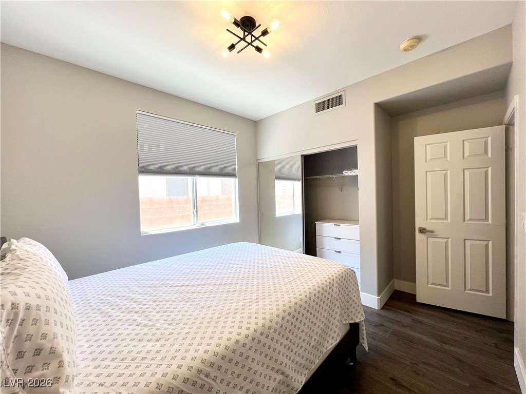 2218 Armacost Drive Henderson, NV 89074 - Photo 25 of 31 Bedroom with a closet and dark wood finished floors
