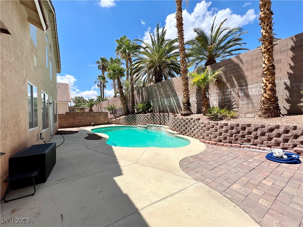 2218 Armacost Drive Henderson, NV 89074 - Photo 26 of 31 View of swimming pool with a fenced backyard and a patio area