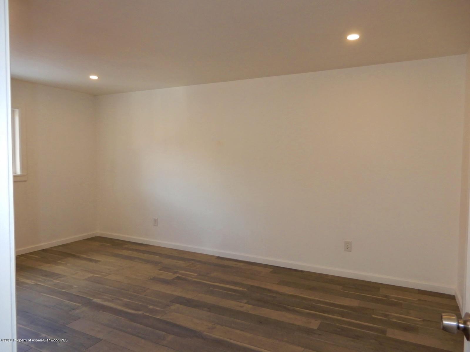 119 June Avenue Rifle, CO 81650 - Photo 19 of 24 a view of room with wooden floor