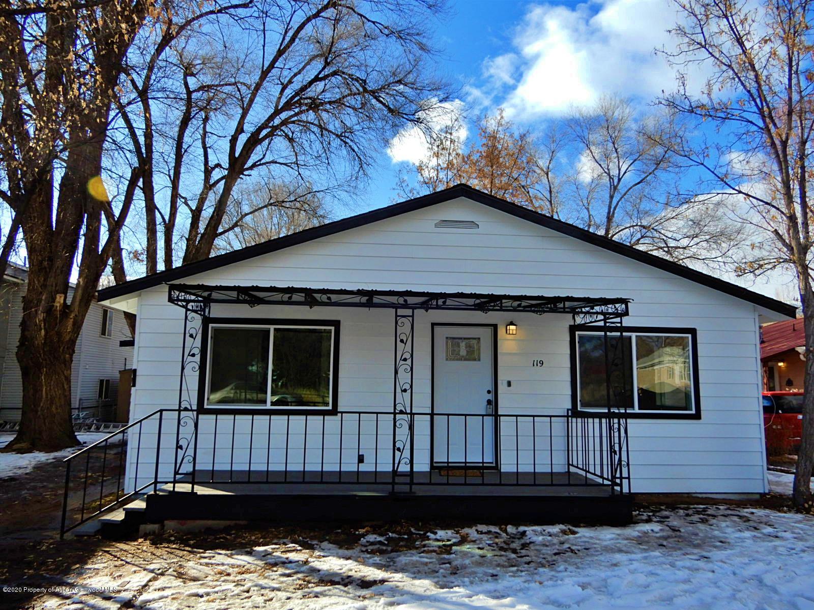 119 June Avenue Rifle, CO 81650 - Photo 2 of 24 a view of a house with a wooden fence