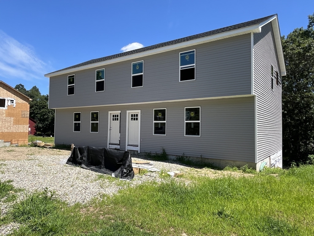 876 Worcester Street Southbridge, MA 01550 - Photo 5 of 11 a front view of a house with a yard