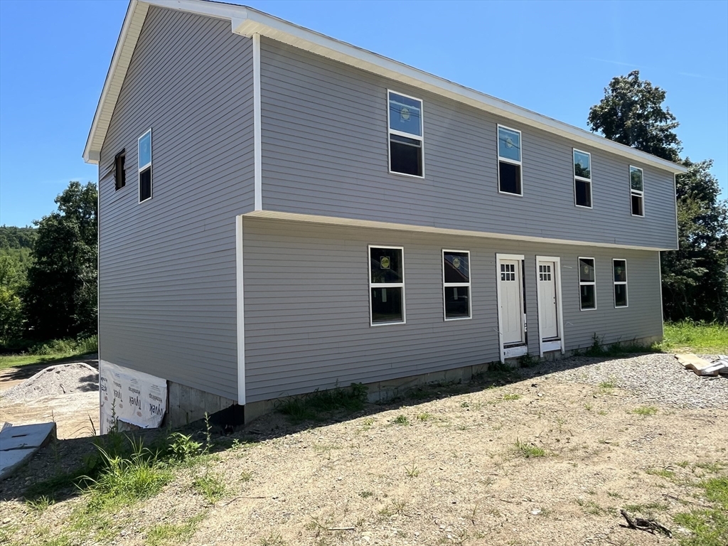 876 Worcester Street Southbridge, MA 01550 - Photo 6 of 11 a front view of a house with a yard