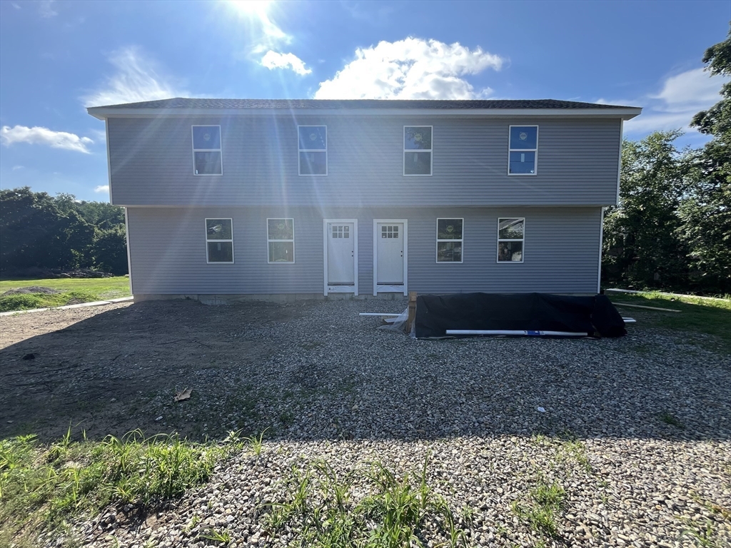 876 Worcester Street Southbridge, MA 01550 - Photo 7 of 11 a view of a house with a yard