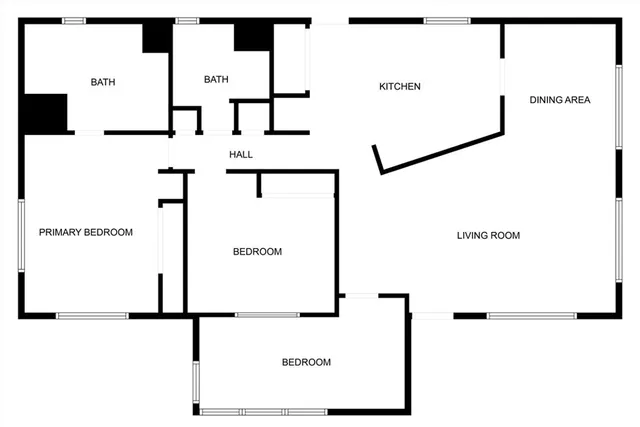 a picture of a bathroom with a white wall