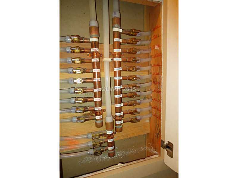 10134 Rice Paper Street Las Vegas, NV 89183 - Photo 34 of 35 Property Photo. Household water control valves in Laundry Room