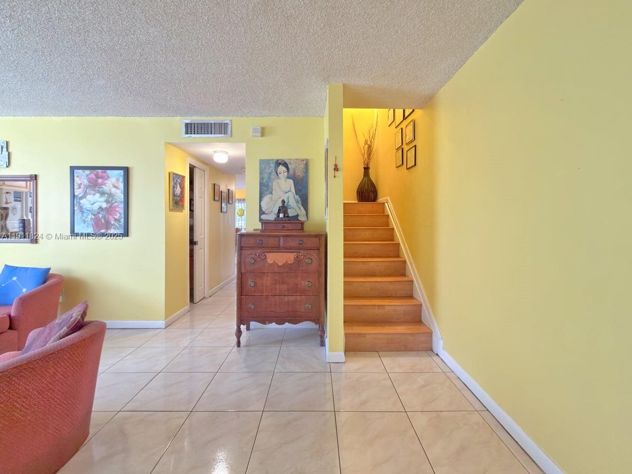 6500 Southwest 41st Court, Unit 88 Davie, FL 33314 - Photo 9 of 19 a view of entryway with furniture and a window