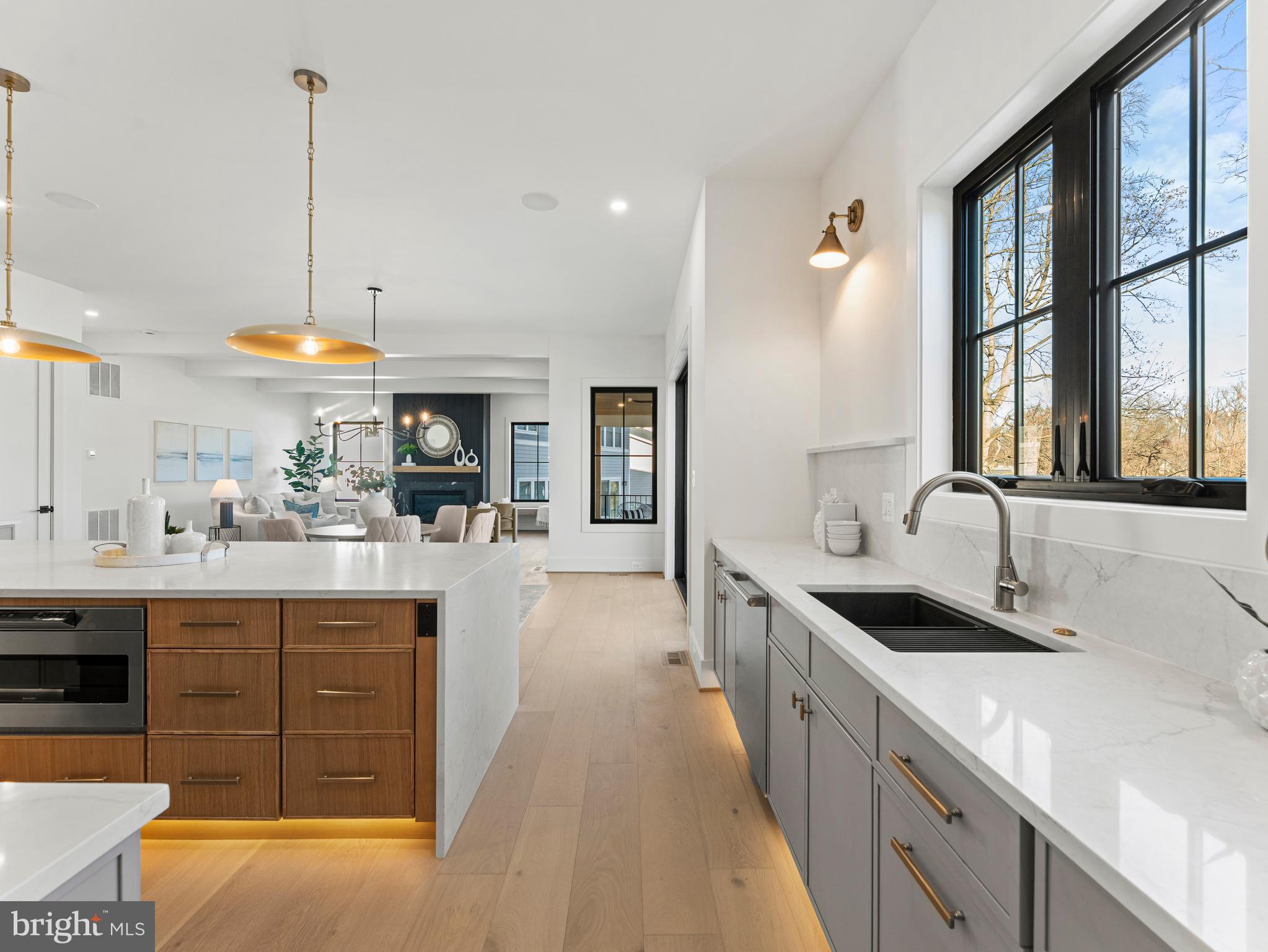406 Dove Circle Southwest Vienna, VA 22180 - Photo 14 of 47 a kitchen with stainless steel appliances granite countertop a sink a stove and a wooden floors