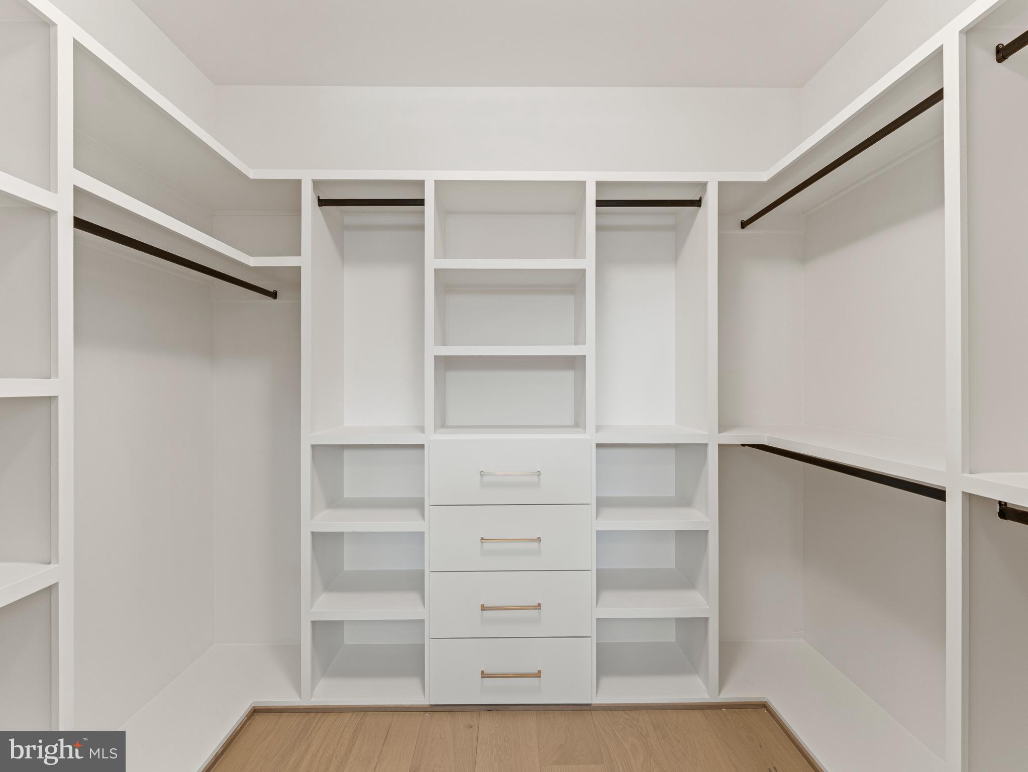406 Dove Circle Southwest Vienna, VA 22180 - Photo 25 of 47 a view of walk in closet with empty racks
