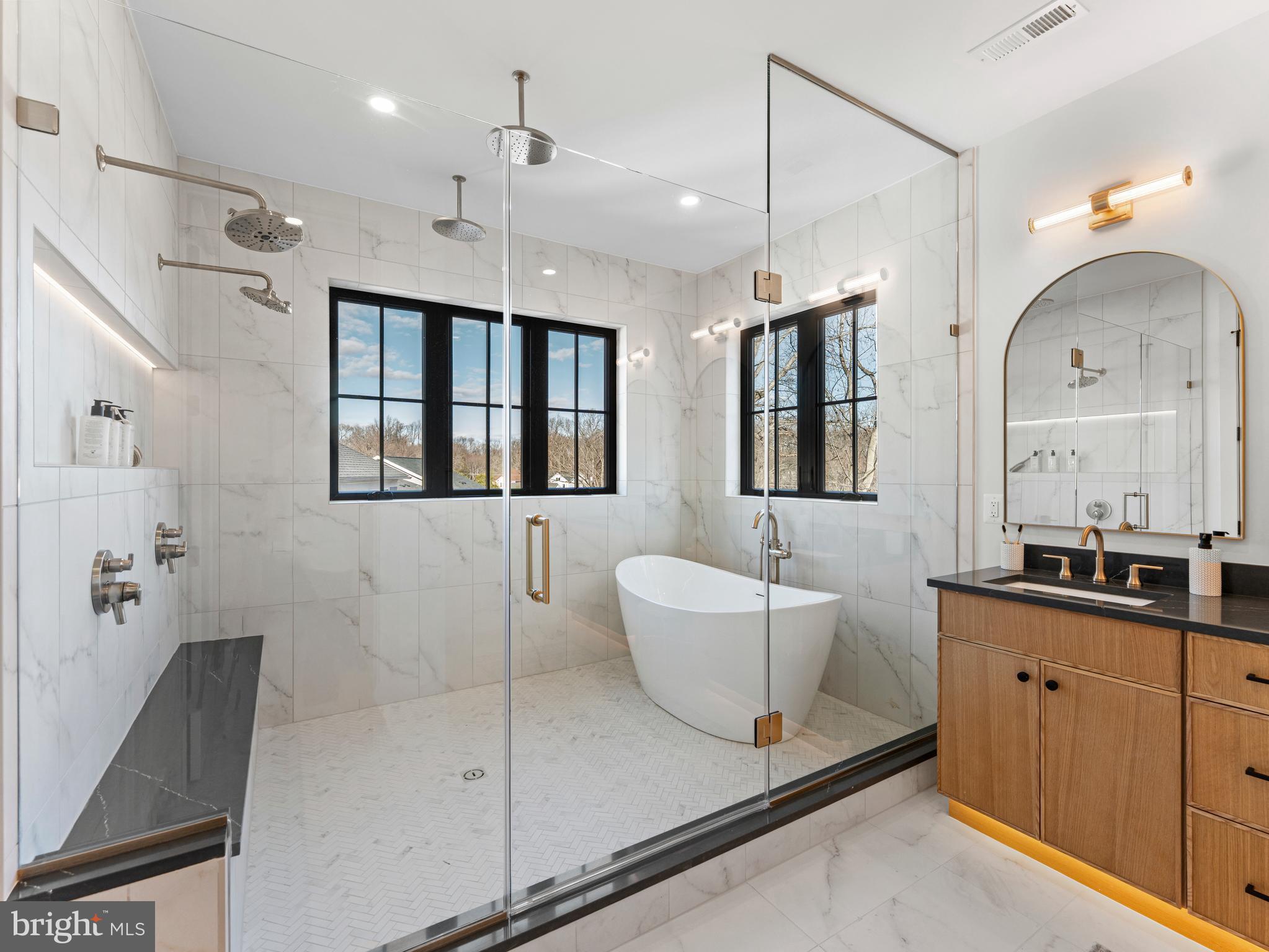 406 Dove Circle Southwest Vienna, VA 22180 - Photo 26 of 47 a bathroom with a double vanity sink a mirror and a shower
