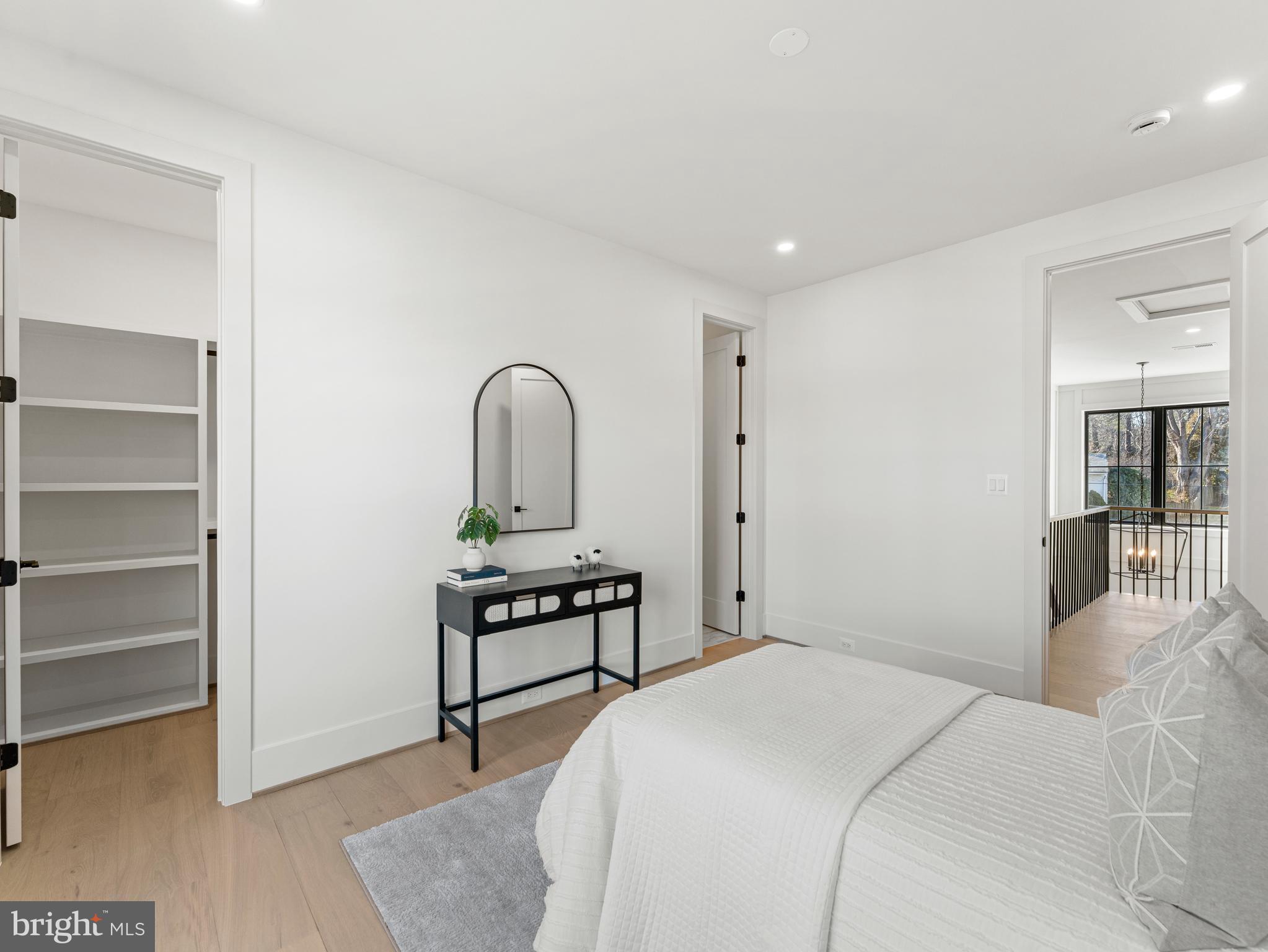 406 Dove Circle Southwest Vienna, VA 22180 - Photo 34 of 47 a bedroom with a bed and a table