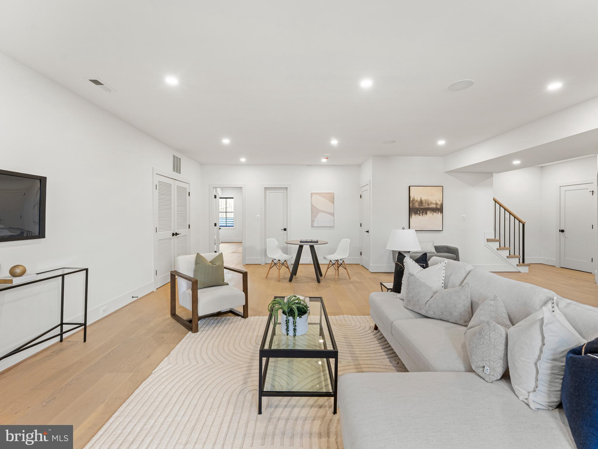 406 Dove Circle Southwest Vienna, VA 22180 - Photo 44 of 47 a living room with furniture and a flat screen tv