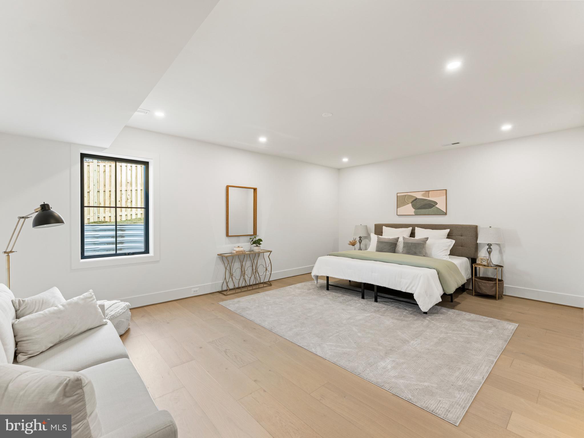 406 Dove Circle Southwest Vienna, VA 22180 - Photo 46 of 47 a spacious bedroom with a bed and a couch