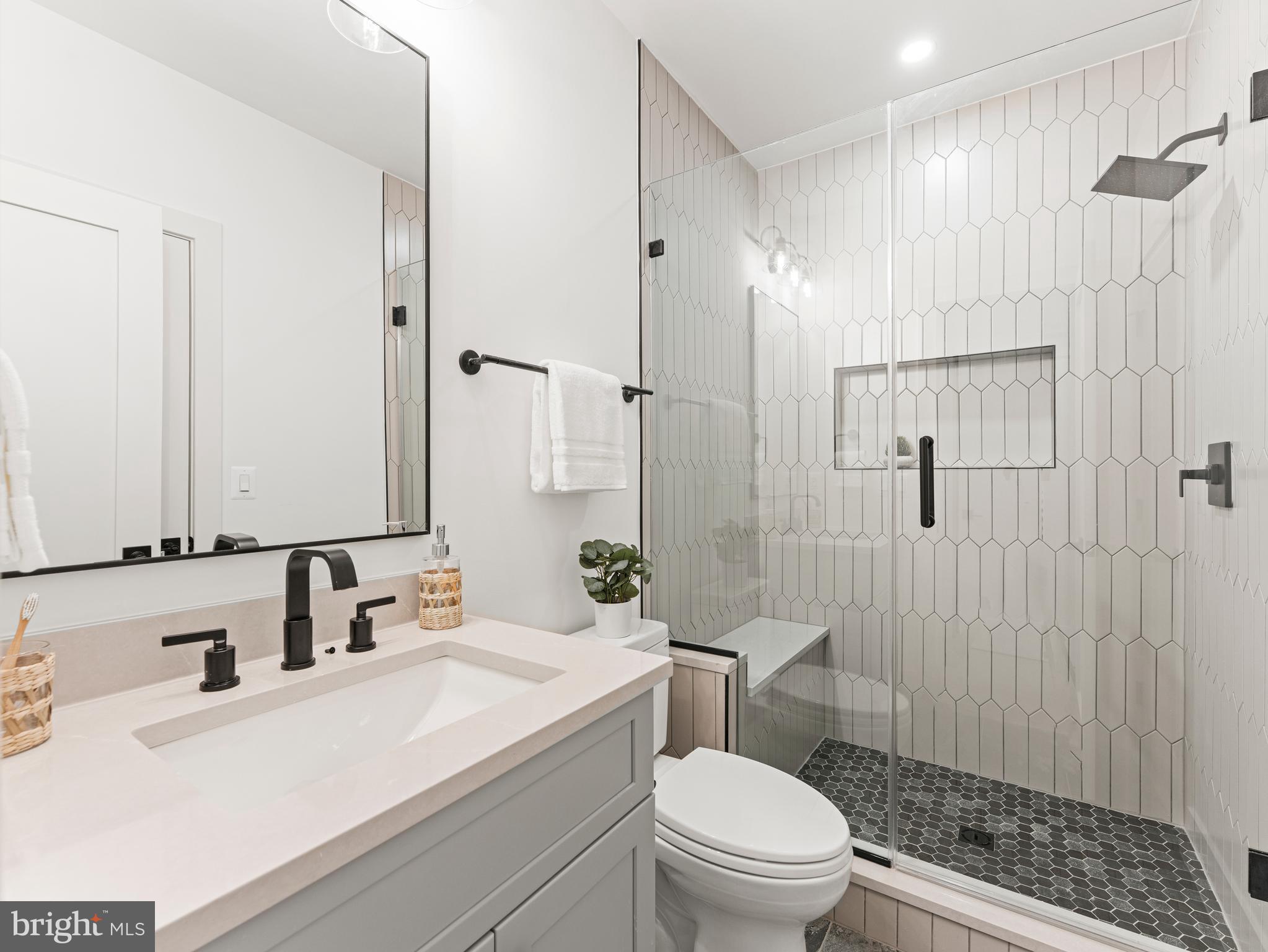 406 Dove Circle Southwest Vienna, VA 22180 - Photo 47 of 47 a bathroom with a sink a toilet and shower