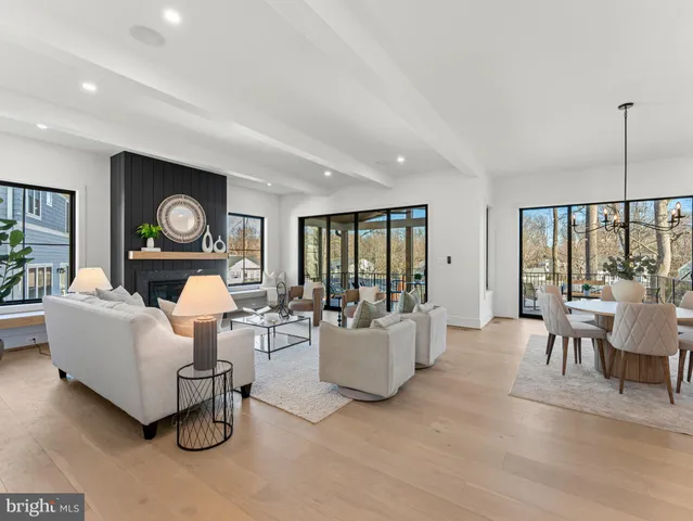 a large kitchen with stainless steel appliances granite countertop a stove a sink and a refrigerator