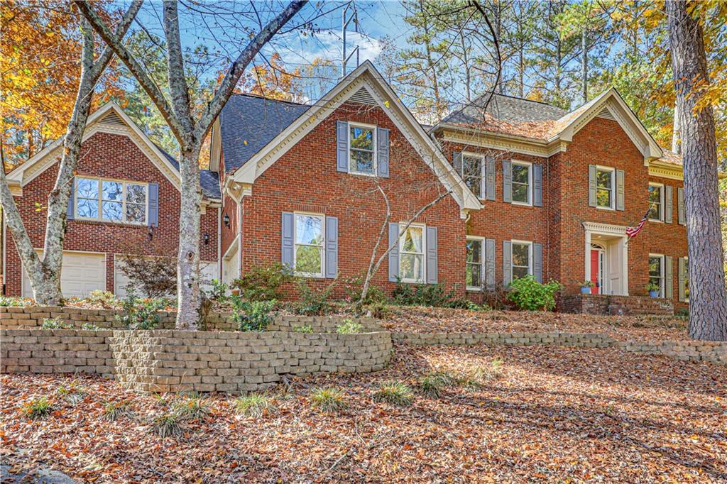 1828 Chedworth Lane Smoke Rise, GA 30087 - Photo 1 of 1 a front view of a house with a yard
