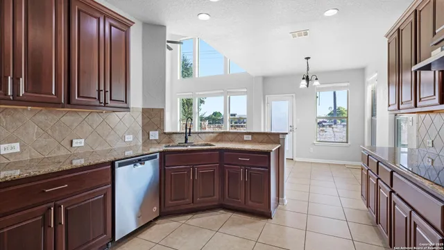 a kitchen with a sink and cabinets