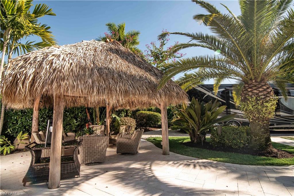 13614 Snapper Lane Naples, FL 34114 - Photo 13 of 19 a view of a house with a patio