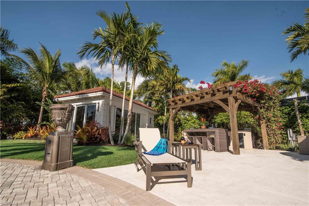 13614 Snapper Lane Naples, FL 34114 - Photo 14 of 19 a view of a chairs and tables in the patio