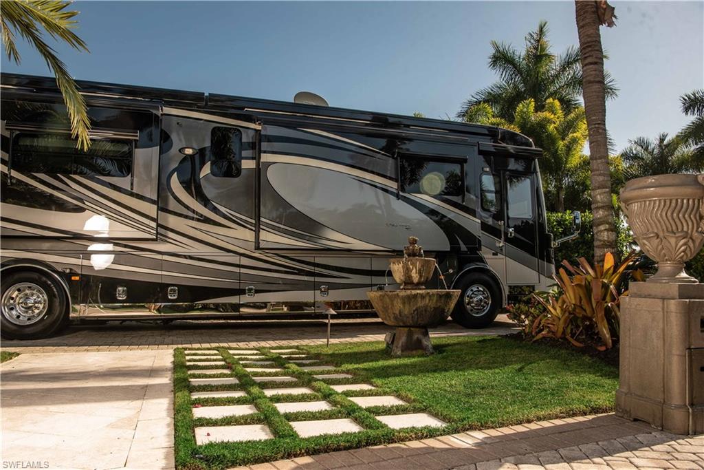 13614 Snapper Lane Naples, FL 34114 - Photo 18 of 19 a view of a car park in front of a house