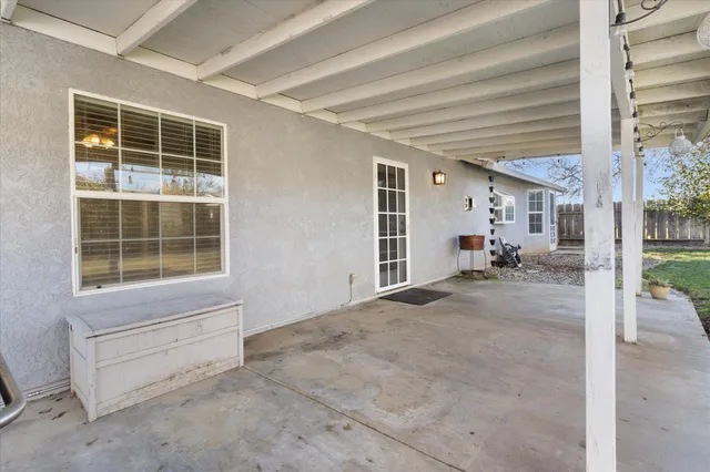 a view of house with outdoor space and porch area
