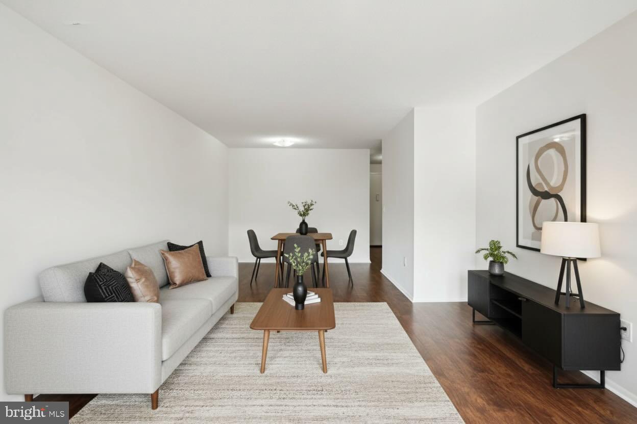 1420 Locust Street, Unit 7O Philadelphia, PA 19102 - Photo 2 of 53 a living room with furniture and wooden floor