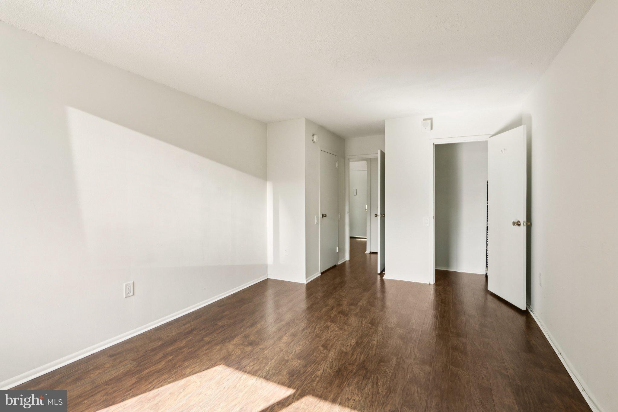 1420 Locust Street, Unit 7O Philadelphia, PA 19102 - Photo 24 of 53 a view of an empty room with wooden floor