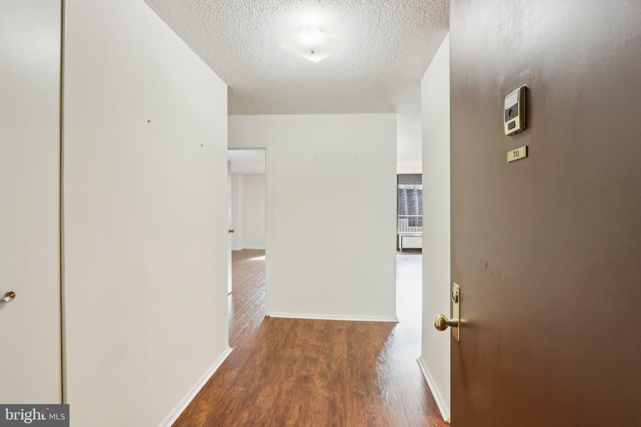 1420 Locust Street, Unit 7O Philadelphia, PA 19102 - Photo 27 of 53 a view of a hallway with wooden floor
