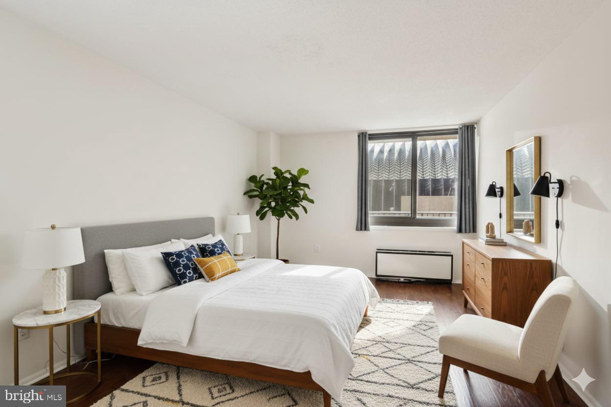 1420 Locust Street, Unit 7O Philadelphia, PA 19102 - Photo 3 of 53 a bedroom with a large bed and windows