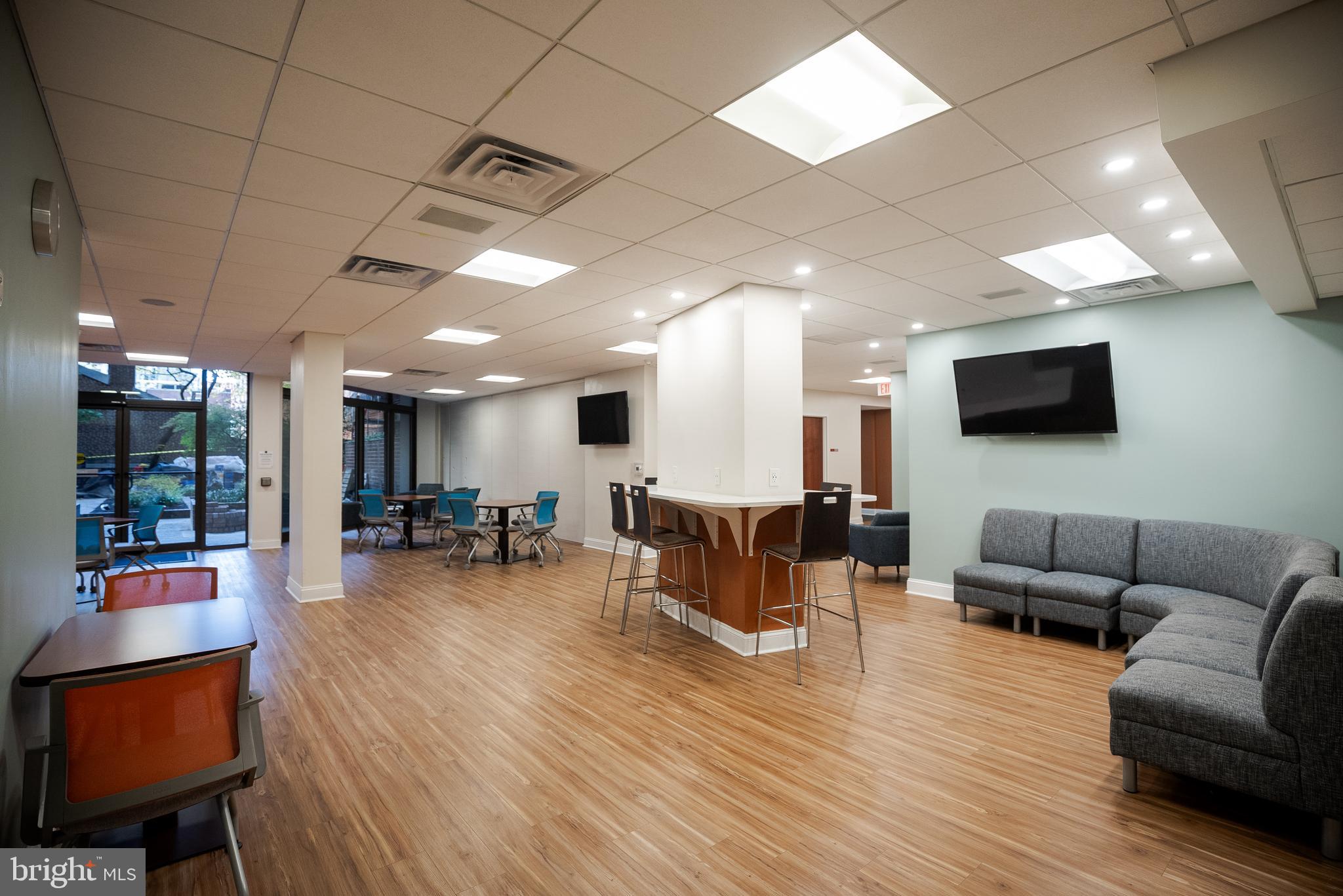 1420 Locust Street, Unit 7O Philadelphia, PA 19102 - Photo 30 of 53 a living room with furniture and a flat screen tv