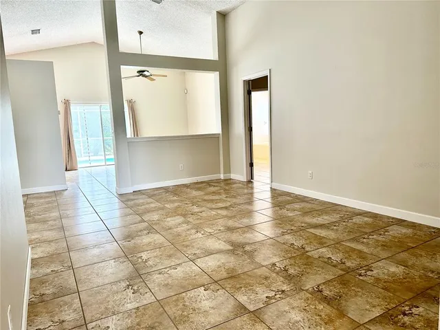 a view of a big room with windows and cabinet