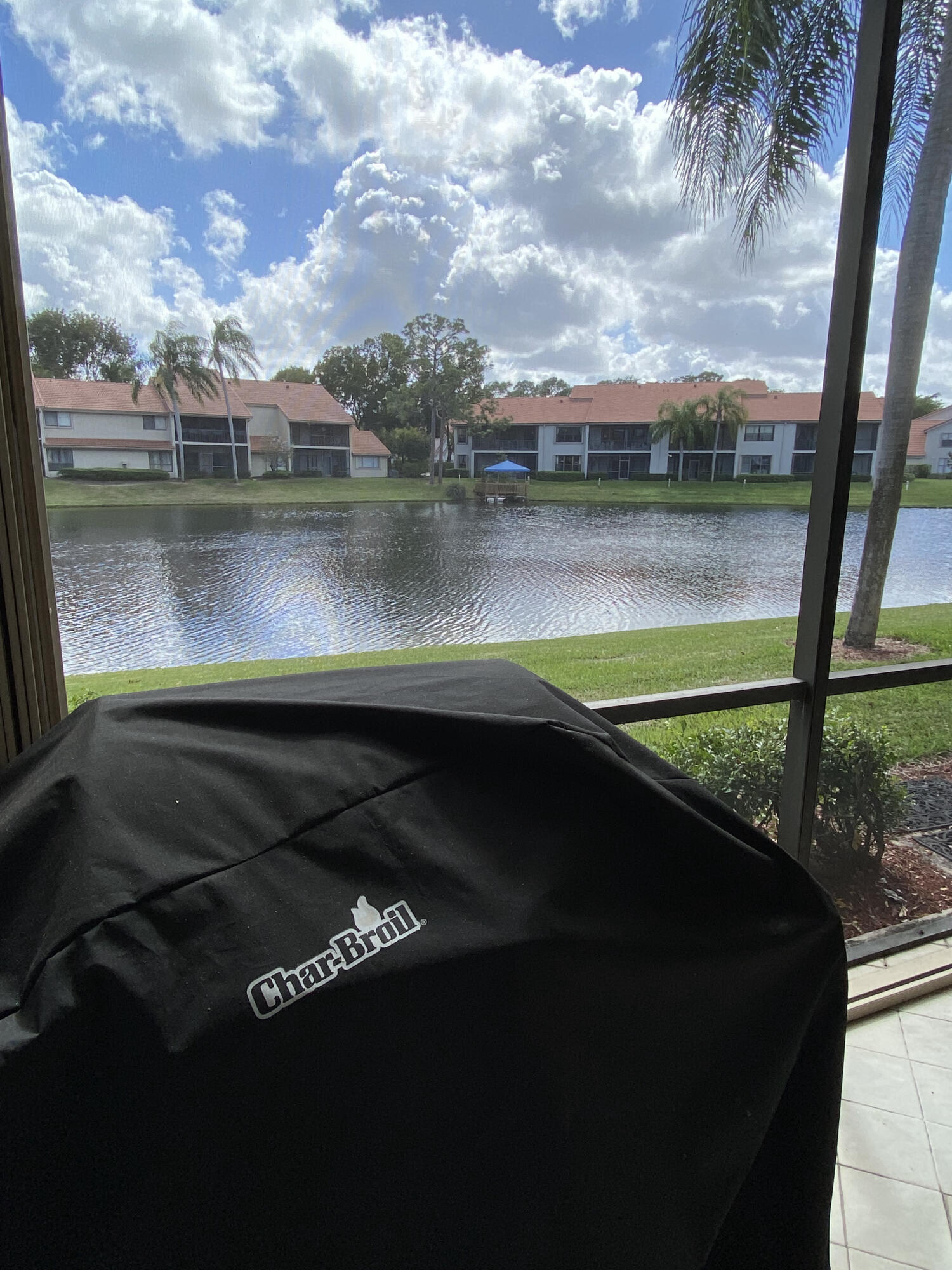 5621 Coach House Circle, Unit D Boca Raton, FL 33486 - Photo 27 of 29 a view of swimming pool from a lake